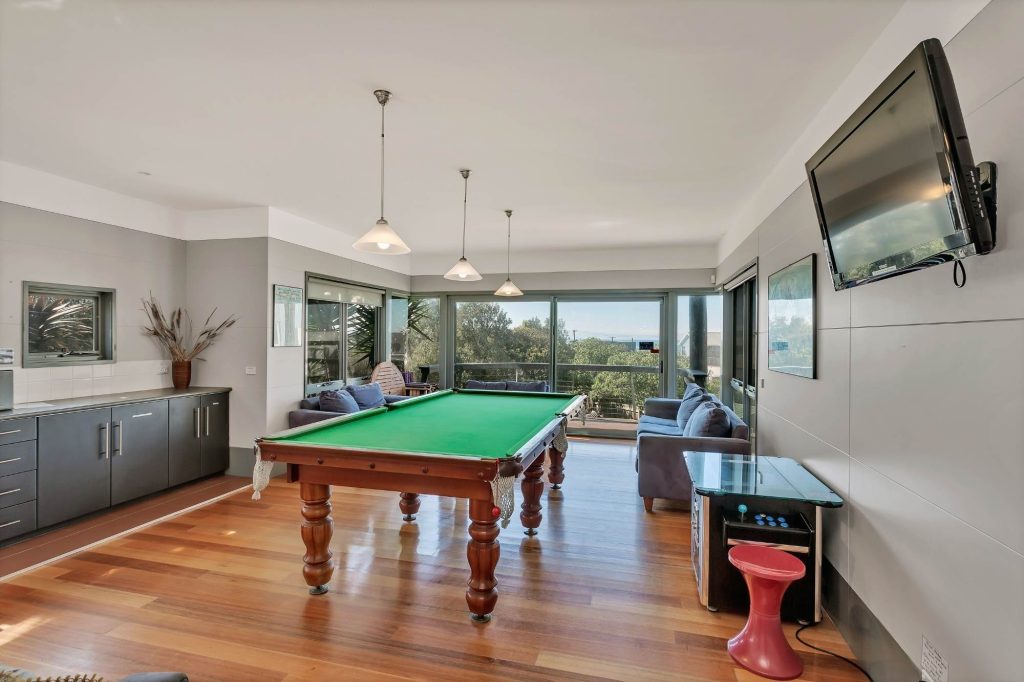 Billiards room with arcade machine